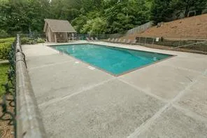 a view of house with swimming pool