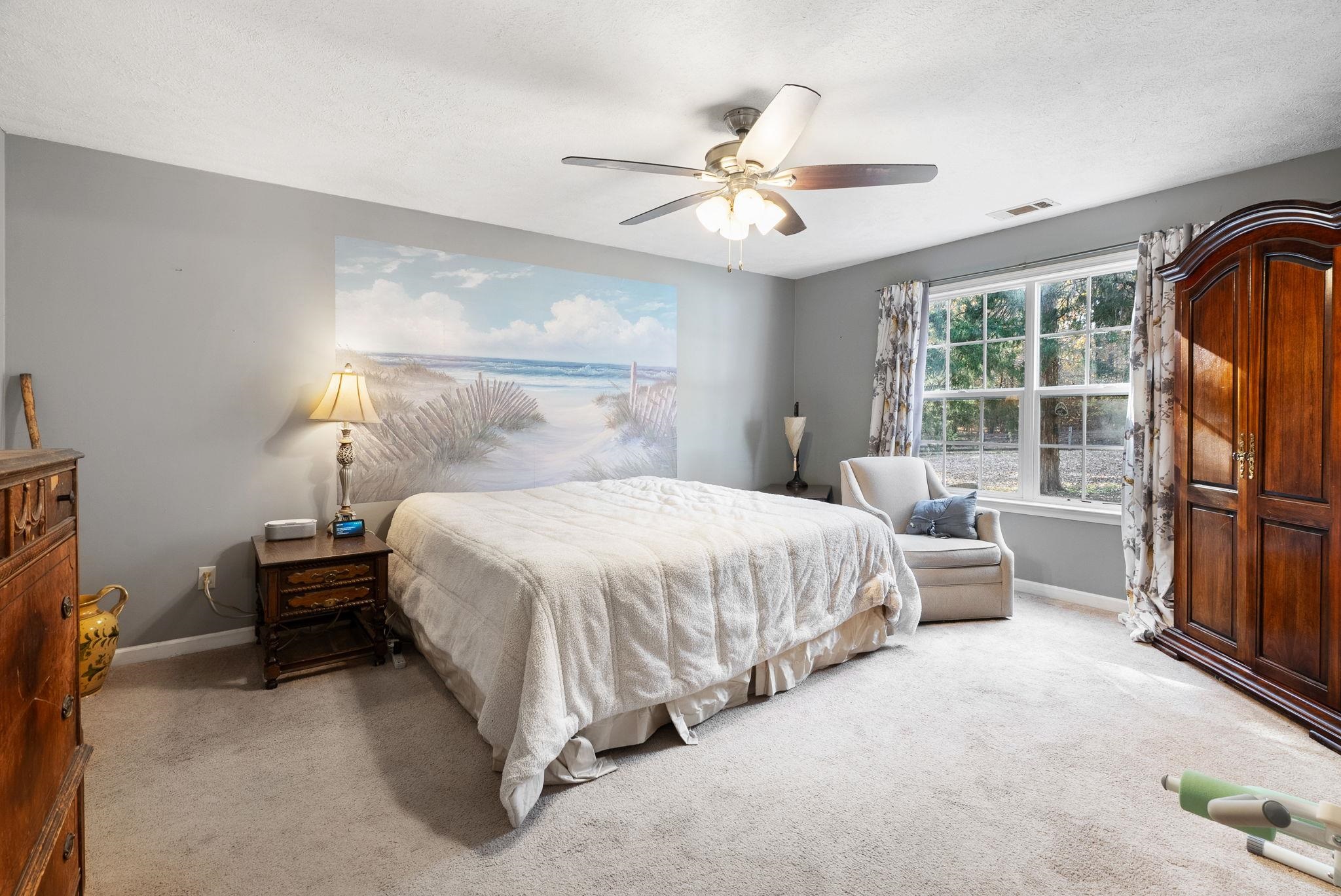 310 Liberty Road Moscow, TN 38057 - Photo 14 of 32 a bedroom with a bed and a chandelier