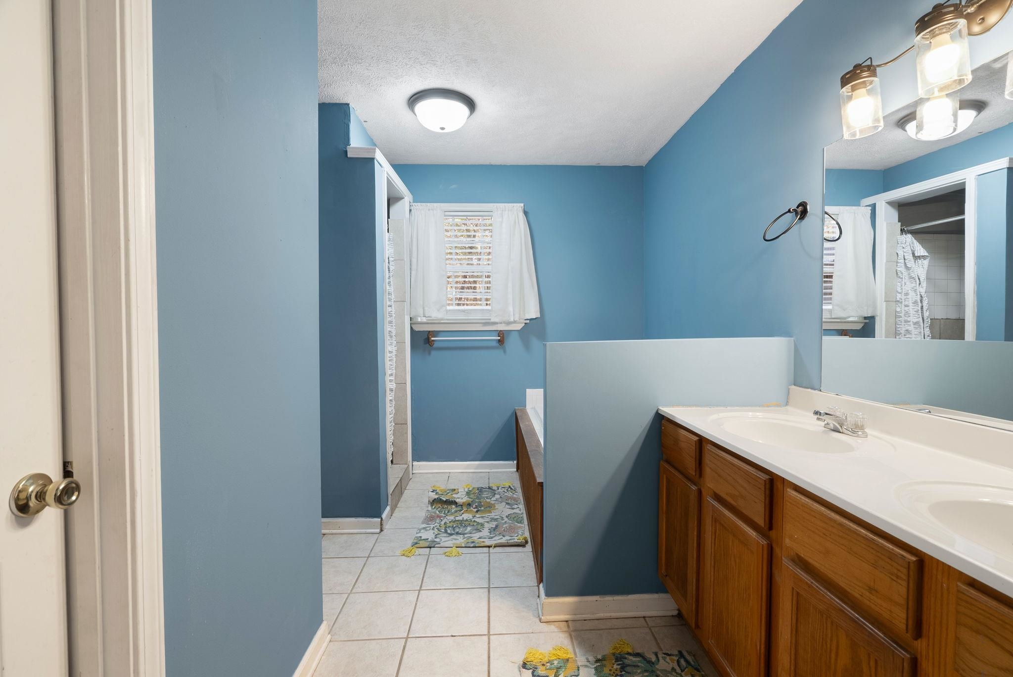 310 Liberty Road Moscow, TN 38057 - Photo 17 of 32 a bath room with a sink furniture and a mirror