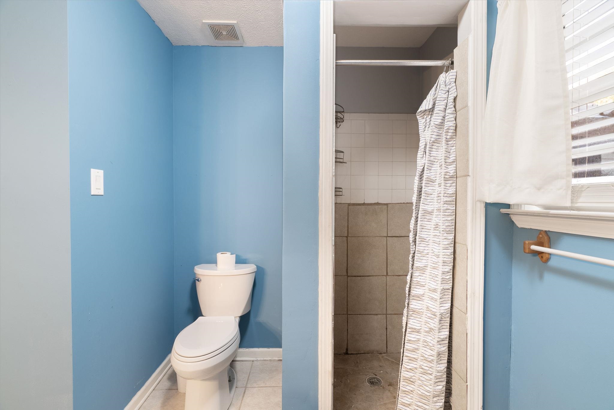 310 Liberty Road Moscow, TN 38057 - Photo 19 of 32 a bathroom with a toilet and a shower