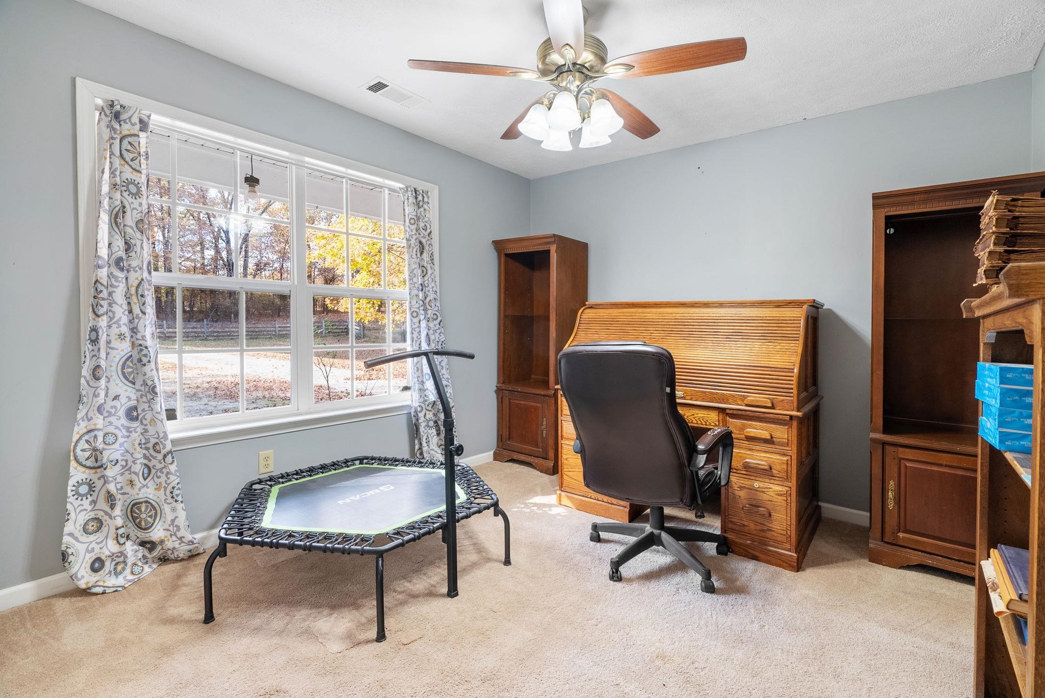 310 Liberty Road Moscow, TN 38057 - Photo 21 of 32 a view of a workspace with furniture and a window