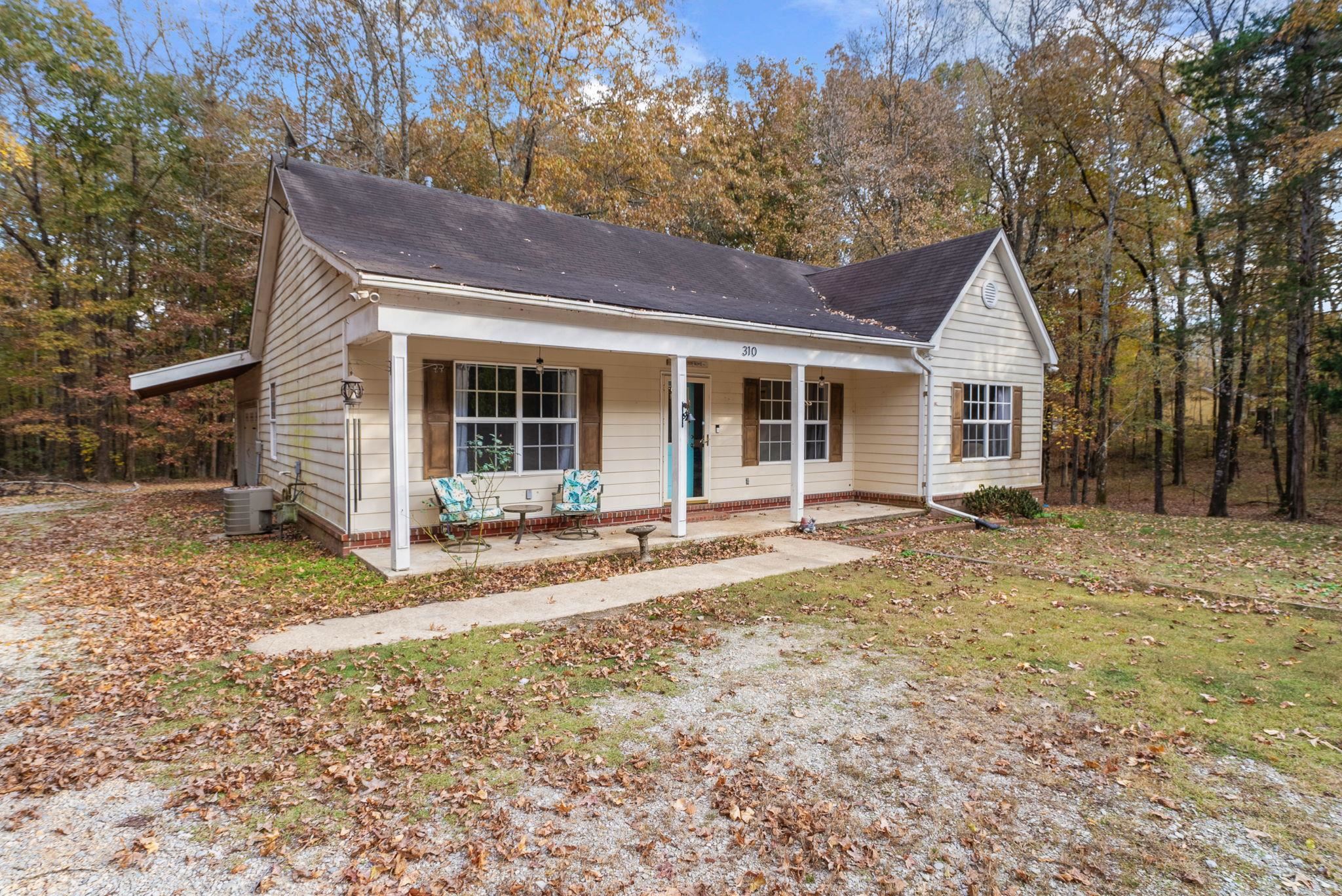 310 Liberty Road Moscow, TN 38057 - Photo 4 of 32 a house with trees in the background