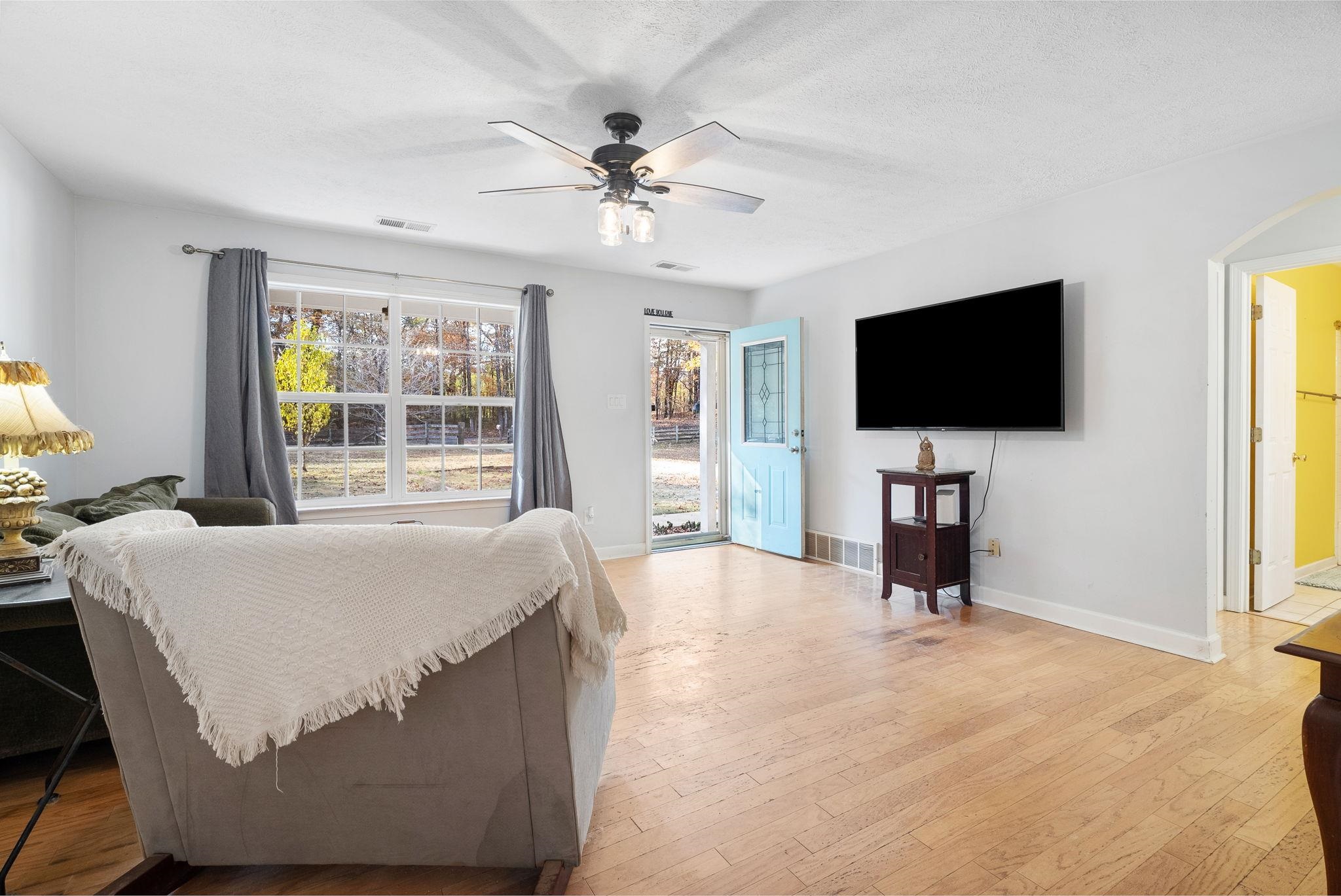 310 Liberty Road Moscow, TN 38057 - Photo 8 of 32 a living room with a flat screen tv and a window