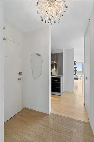 a view interior of a house an empty room and chandelier fan