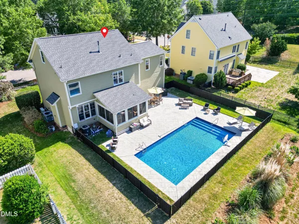an aerial view of a house with pool