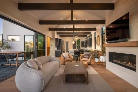 a living room with furniture fireplace and flat screen tv