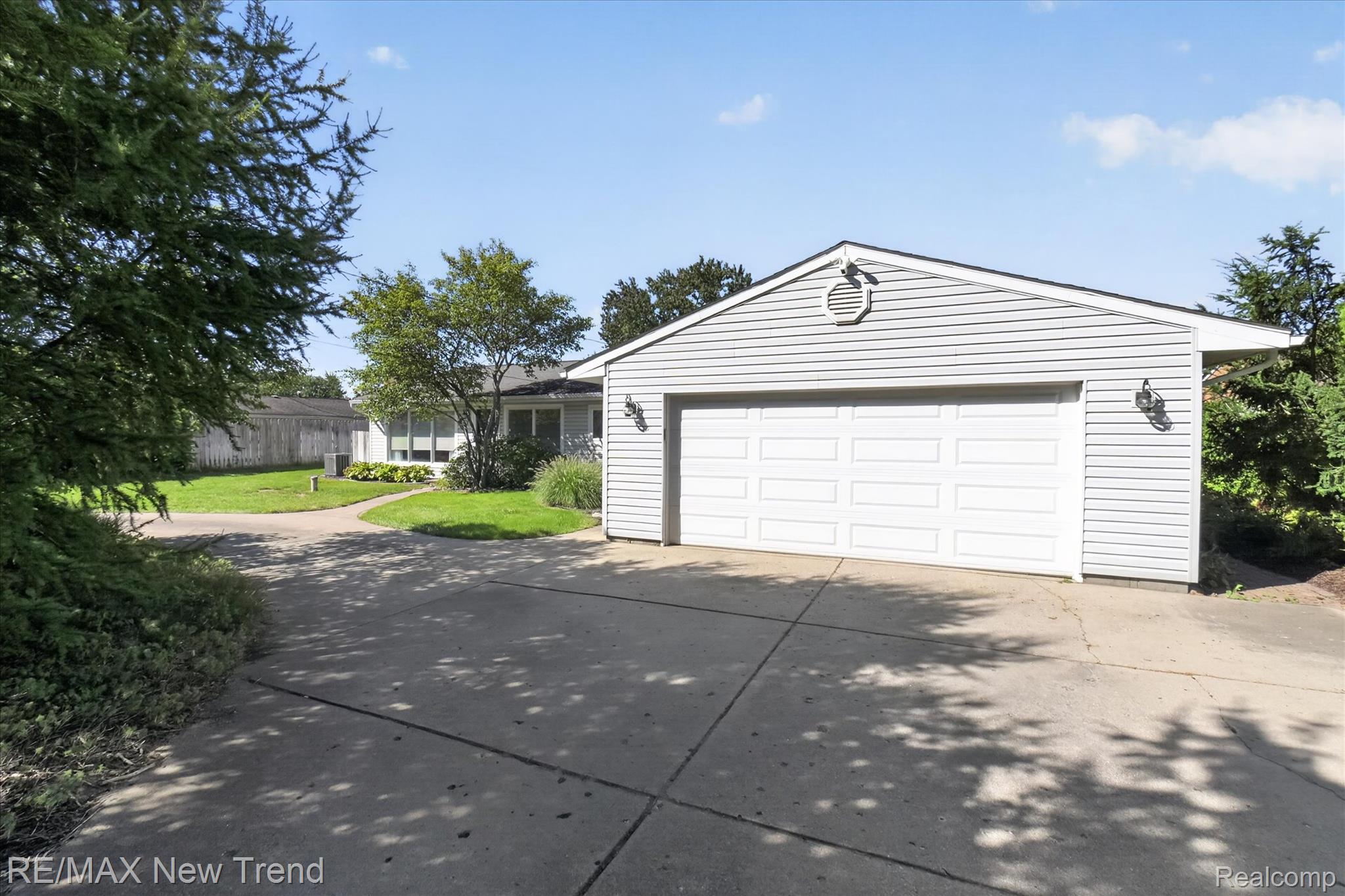 2529 South Commerce Road Walled Lake, MI 48390 - Photo 3 of 66 Detached garage with horizontal siding and a dual panel garage door
