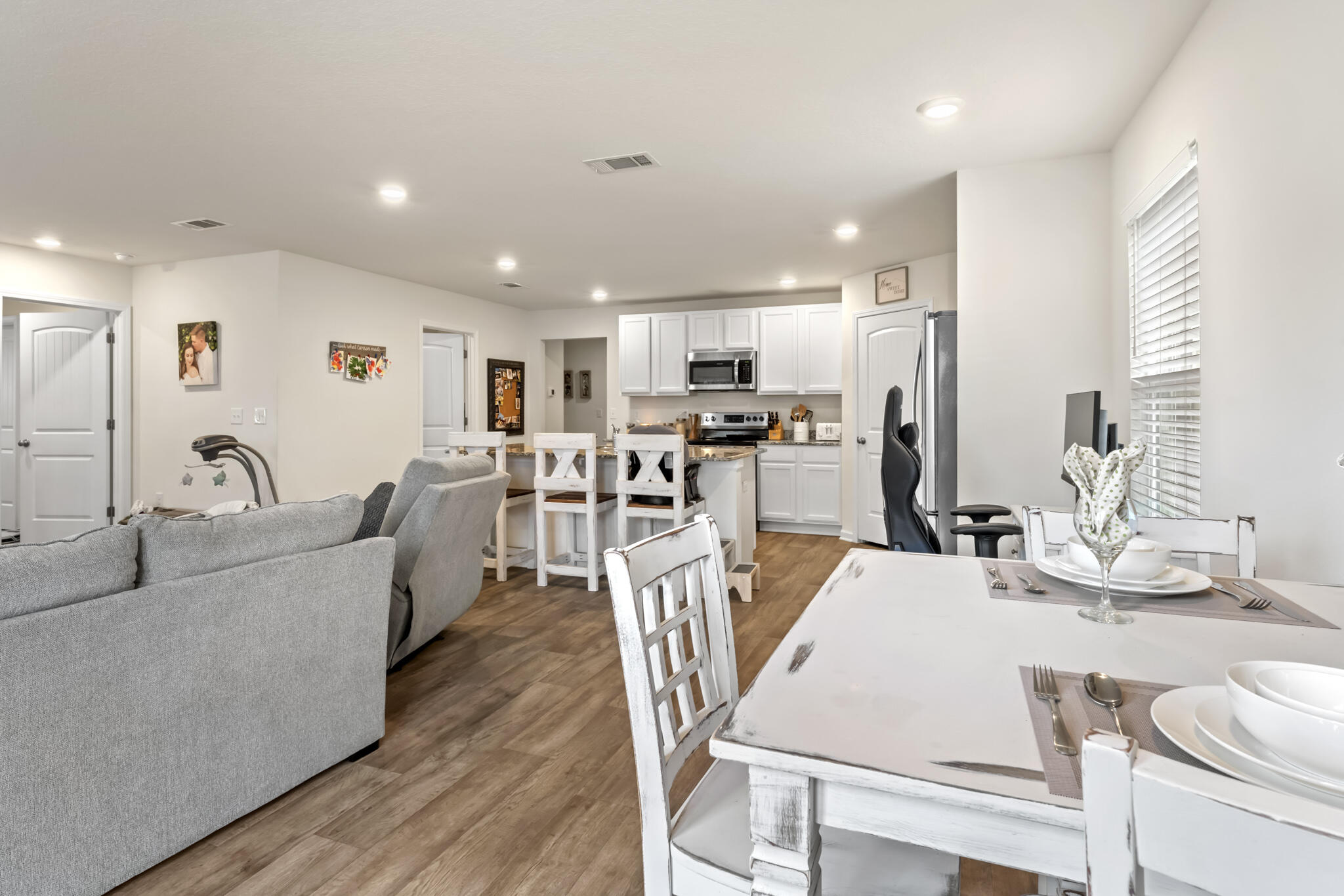 916 Merganser Way Crestview, FL 32539 - Photo 14 of 27 a living room with stainless steel appliances kitchen island granite countertop furniture and a kitchen view