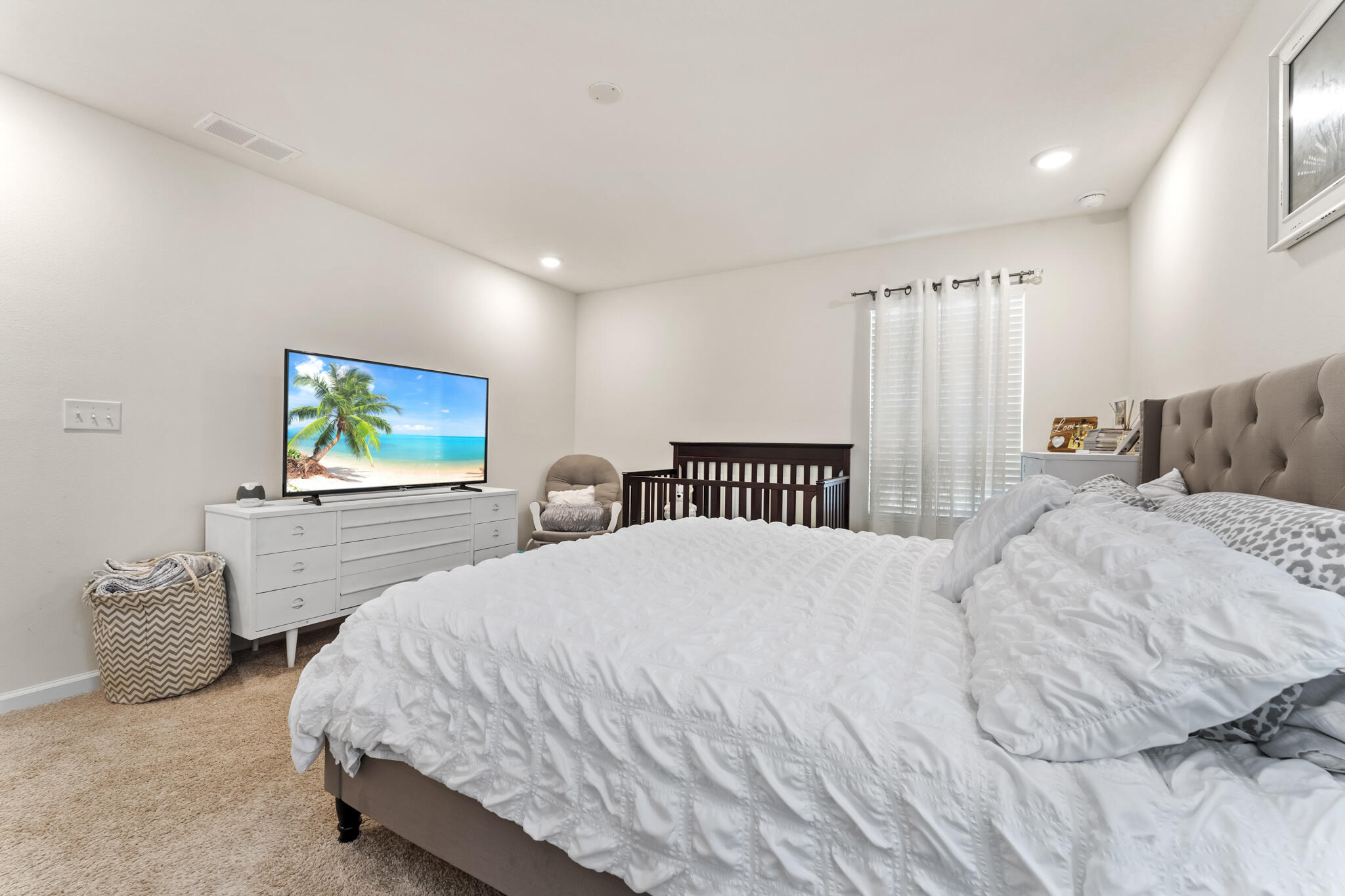 916 Merganser Way Crestview, FL 32539 - Photo 16 of 27 a bedroom with a bed and a flat screen tv