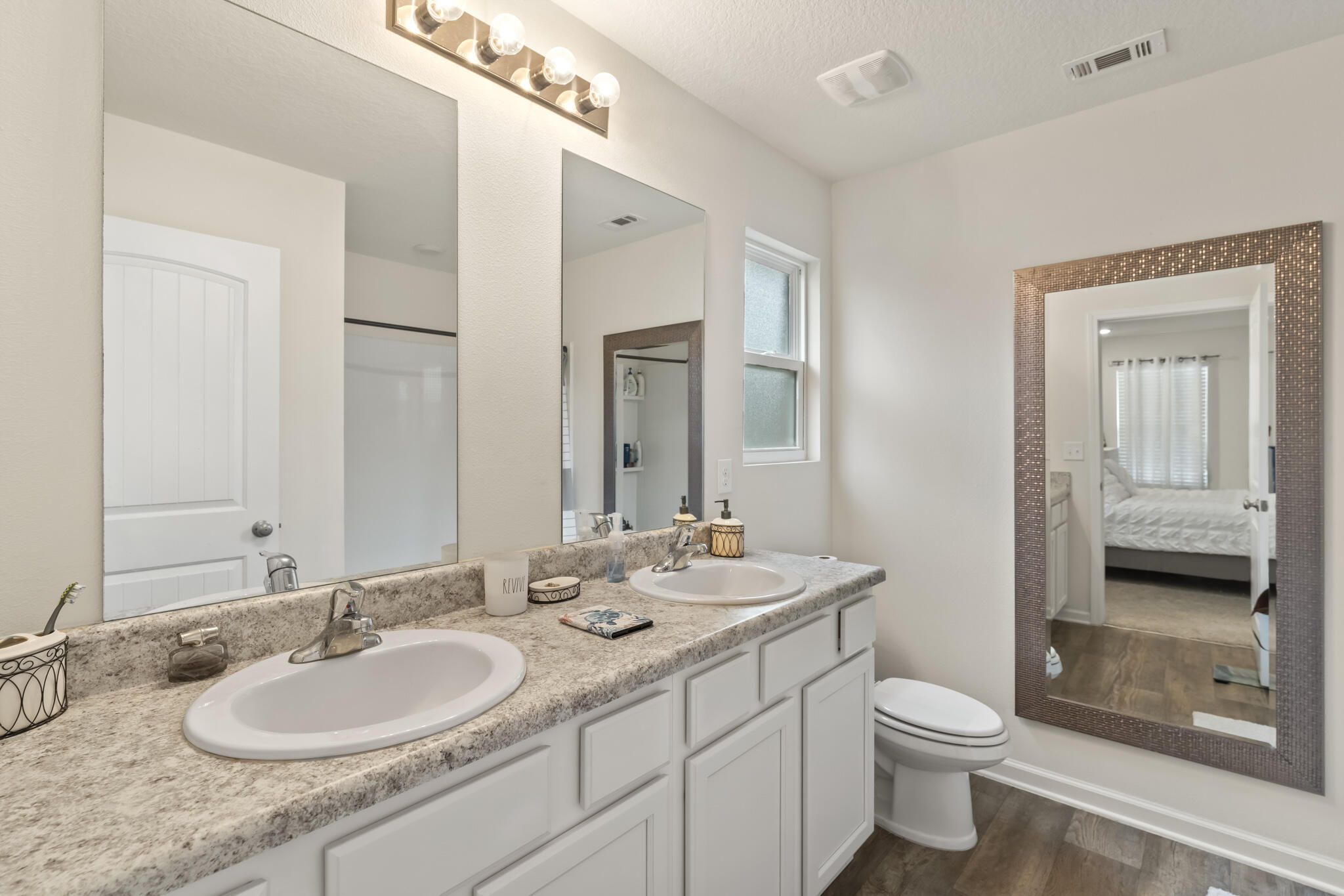 916 Merganser Way Crestview, FL 32539 - Photo 17 of 27 a bathroom with a granite countertop sink and a mirror