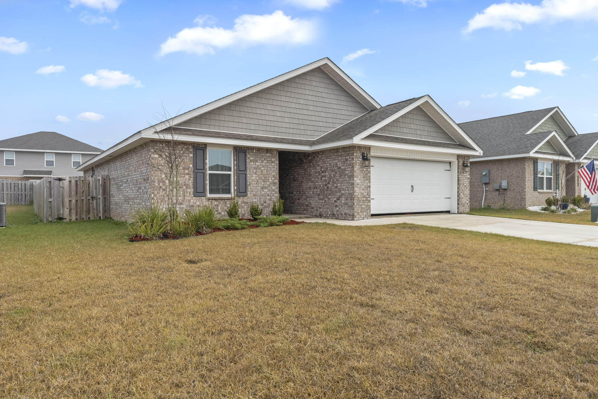 916 Merganser Way Crestview, FL 32539 - Photo 2 of 27 a front view of a house with a yard