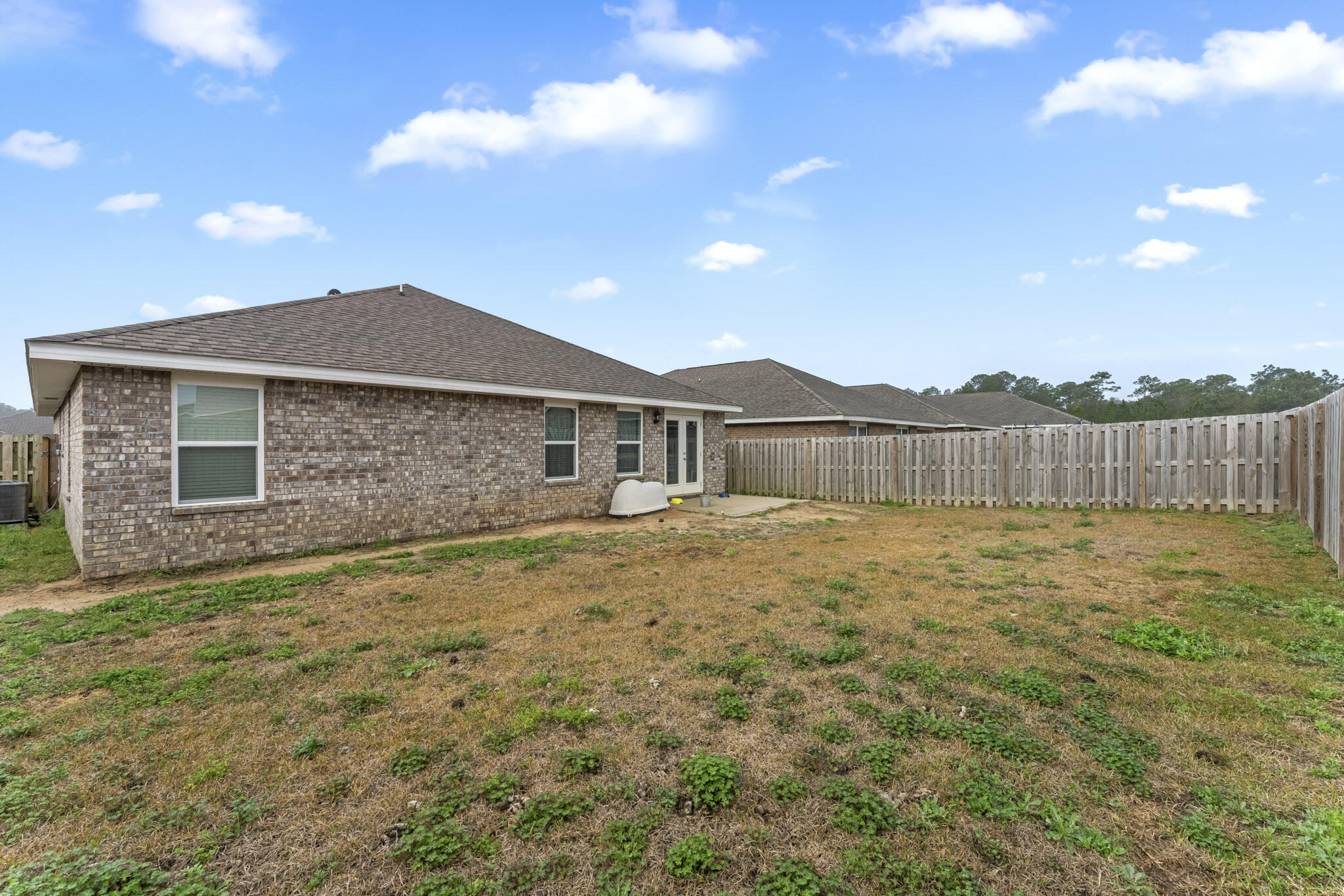 916 Merganser Way Crestview, FL 32539 - Photo 26 of 27 a view of a house with a backyard