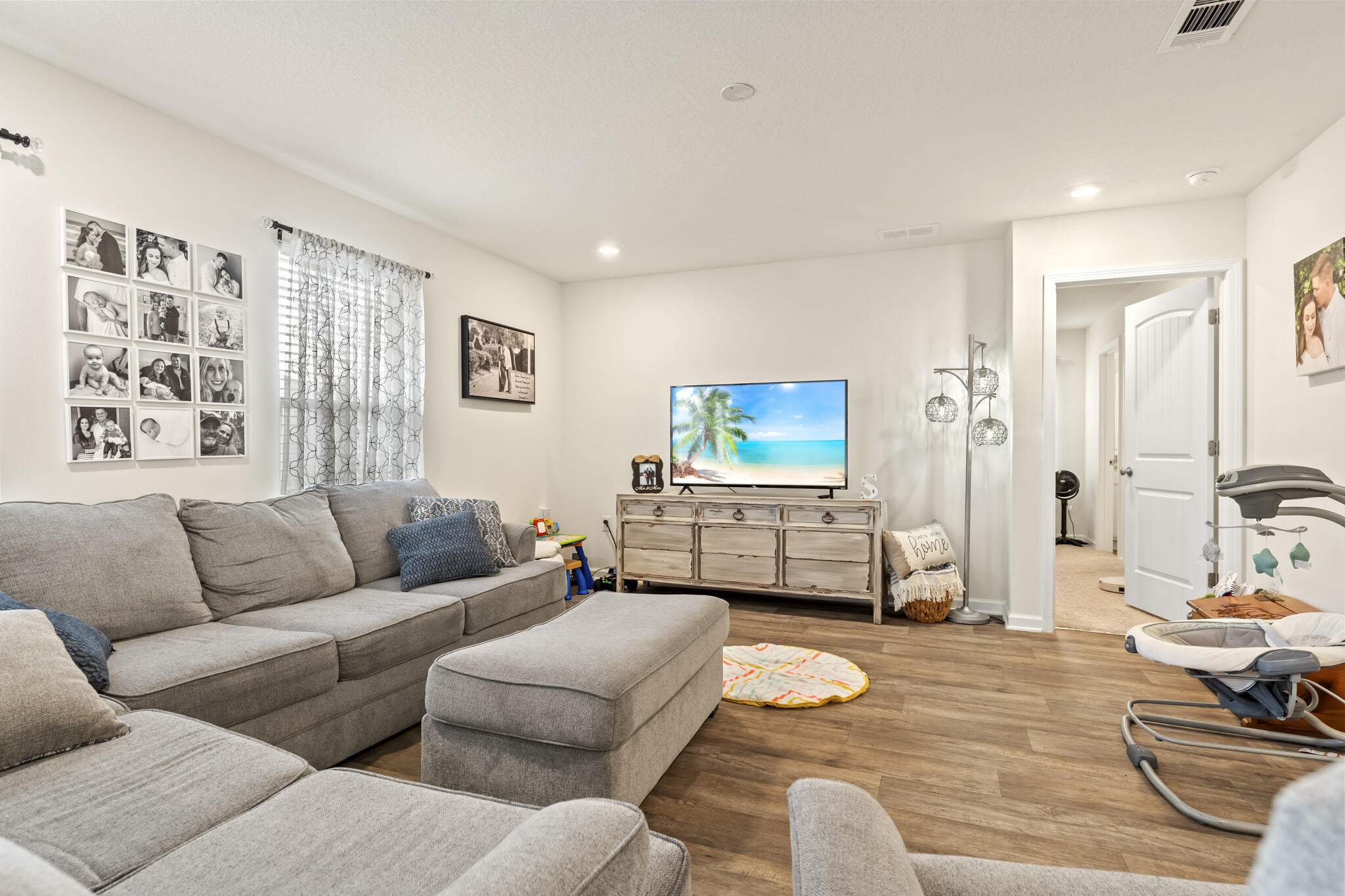 916 Merganser Way Crestview, FL 32539 - Photo 8 of 27 a living room with furniture and a flat screen tv