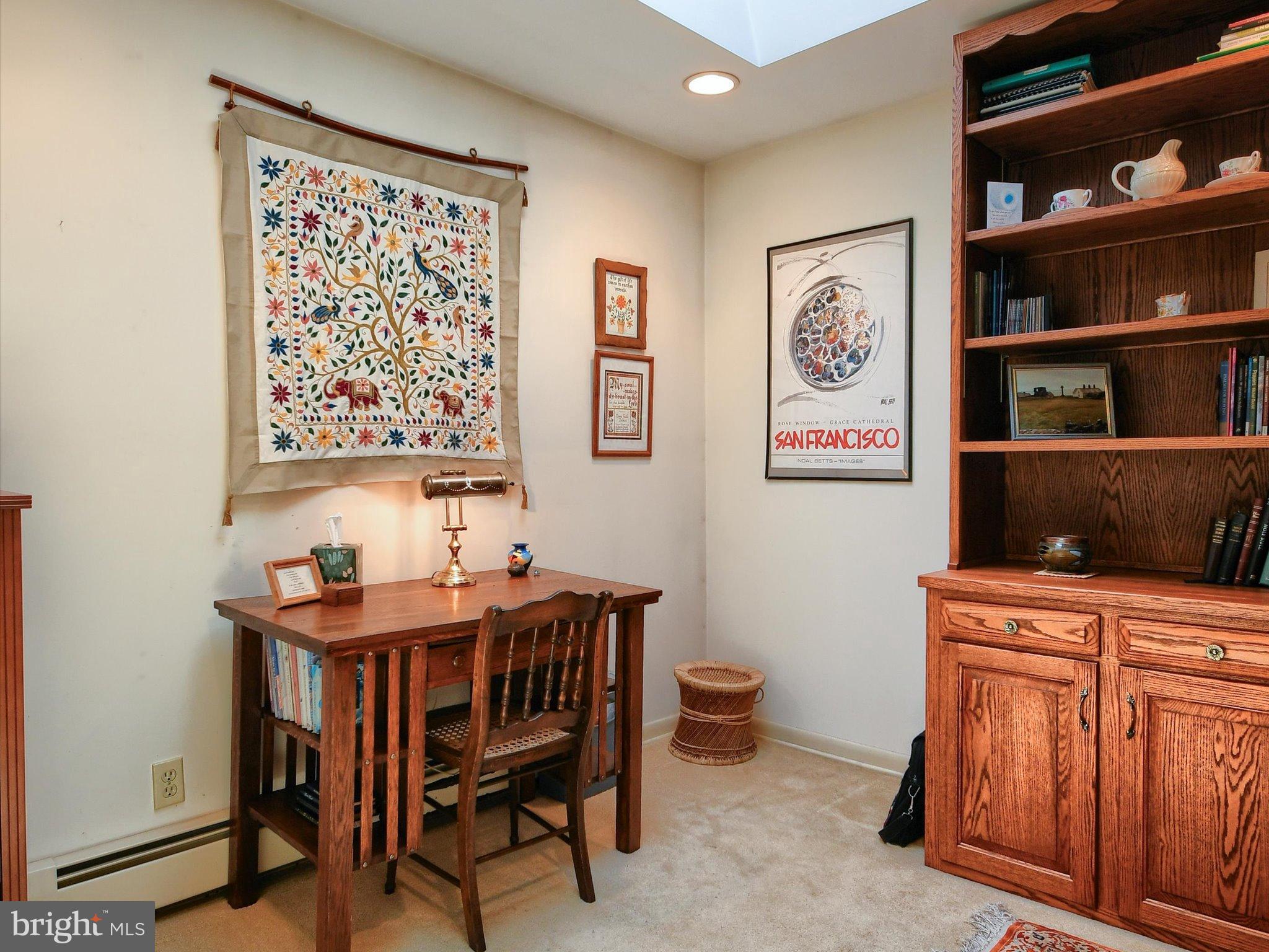 1209 Telegraph Road Perkasie, PA 18944 - Photo 14 of 49 a dining room with bookshelf and wooden floor
