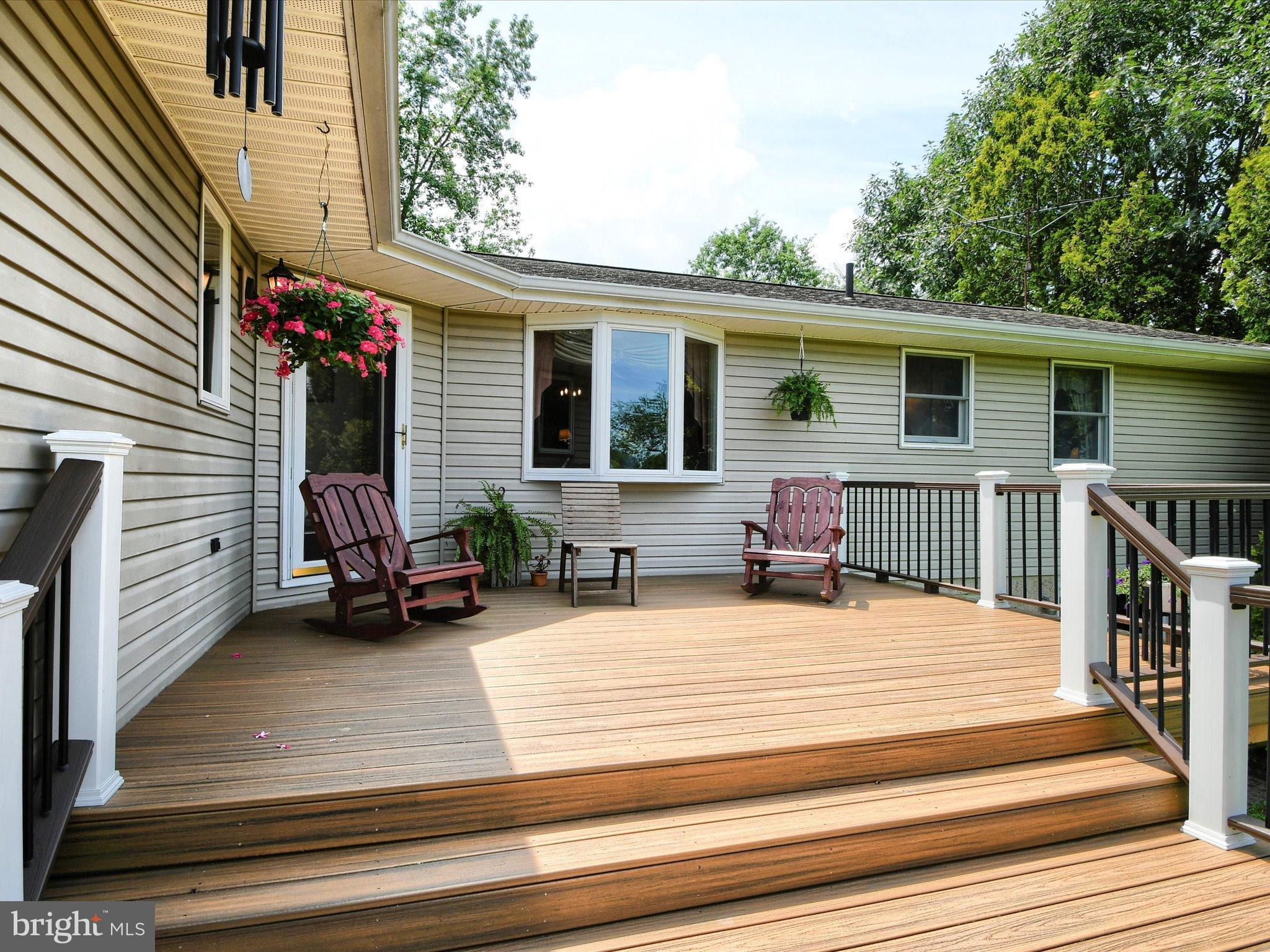 1209 Telegraph Road Perkasie, PA 18944 - Photo 17 of 49 a view of a lounge chairs in the back yard of the house