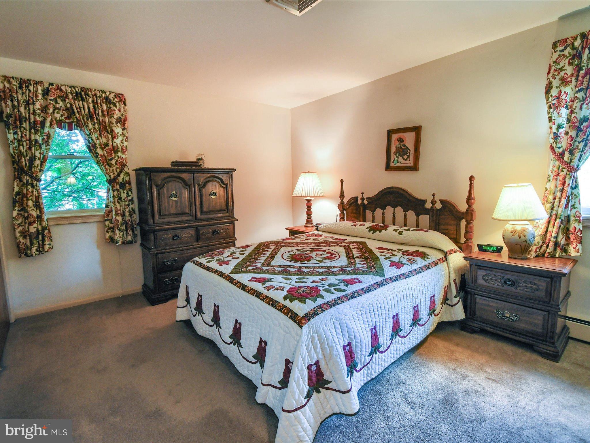 1209 Telegraph Road Perkasie, PA 18944 - Photo 18 of 49 a bed sitting in a room next to a window