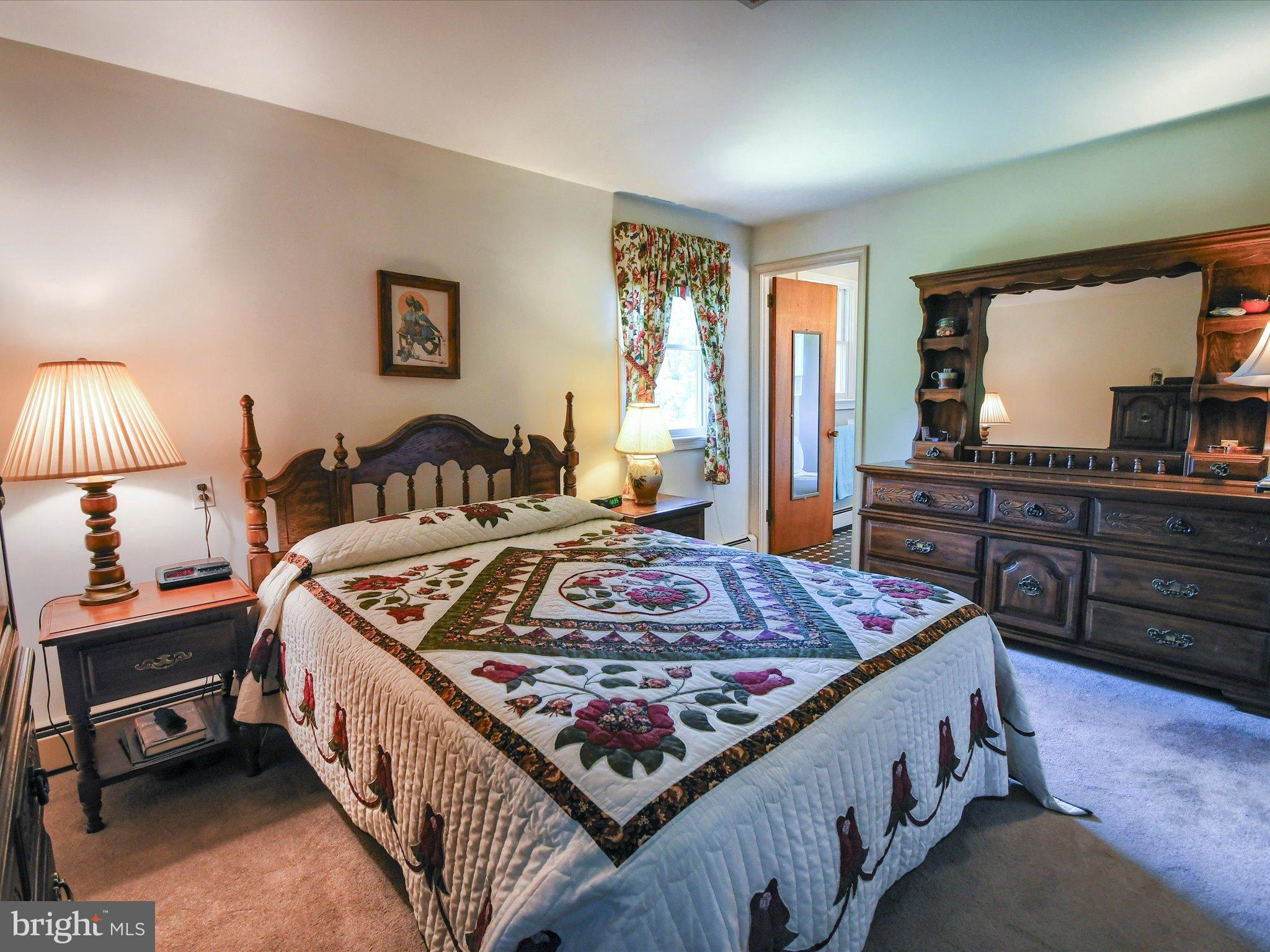 1209 Telegraph Road Perkasie, PA 18944 - Photo 19 of 49 a bed sitting in a bedroom next to a window