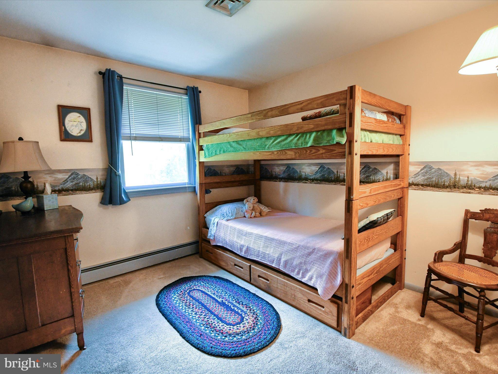 1209 Telegraph Road Perkasie, PA 18944 - Photo 22 of 49 a bedroom with a bed and wooden floor