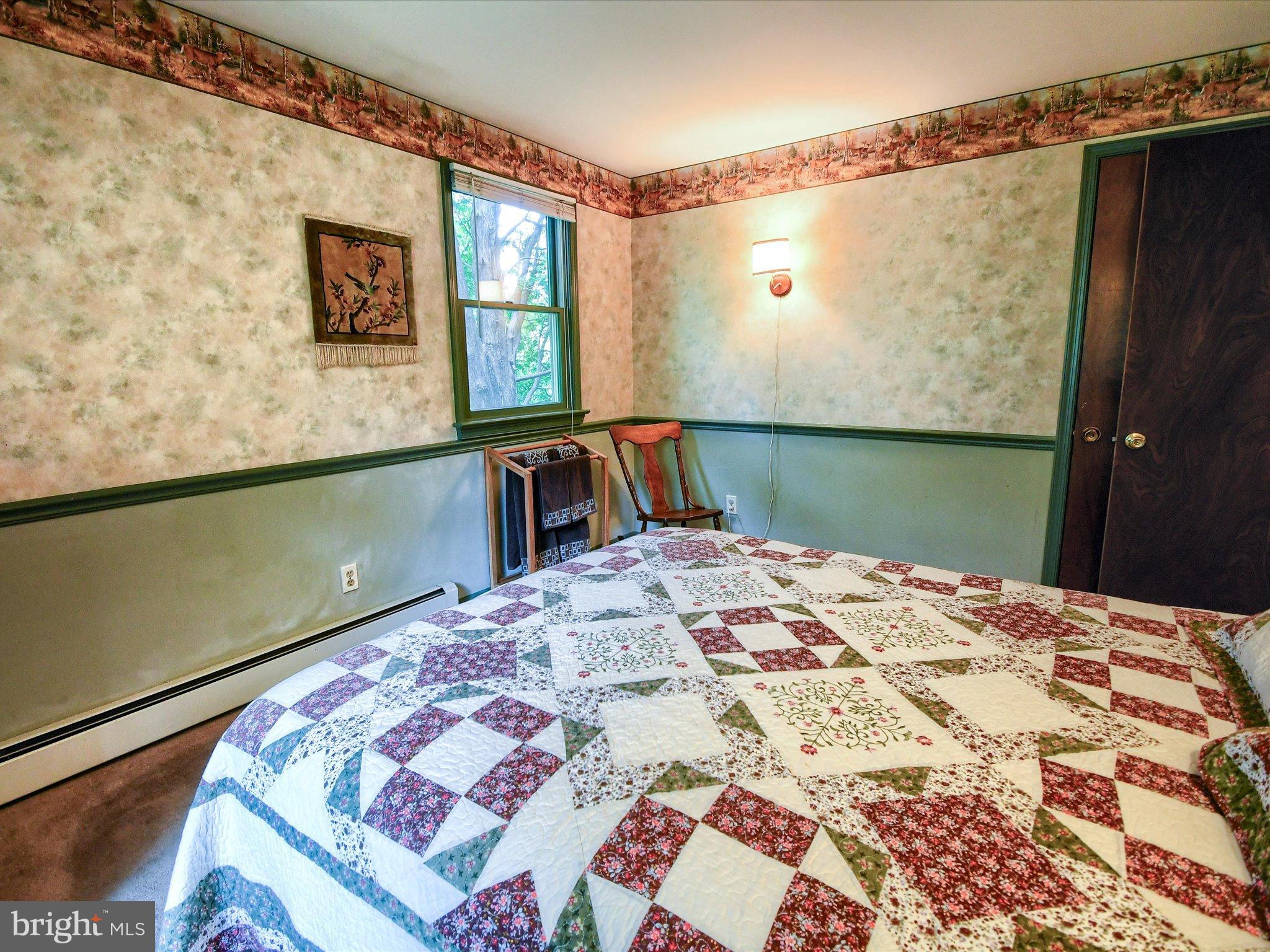 1209 Telegraph Road Perkasie, PA 18944 - Photo 25 of 49 a bed sitting in a bedroom next to a window