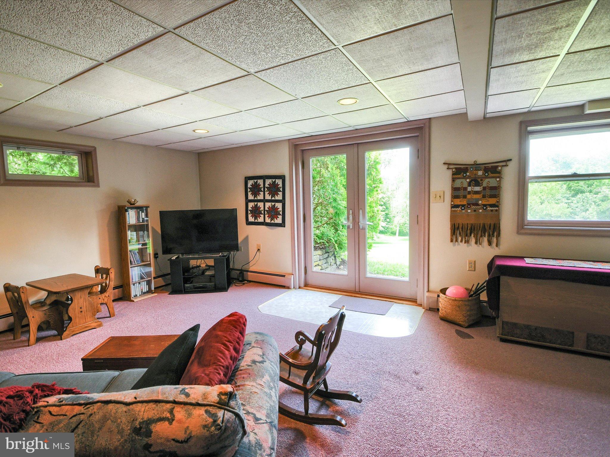 1209 Telegraph Road Perkasie, PA 18944 - Photo 31 of 49 a living room with furniture and a flat screen tv