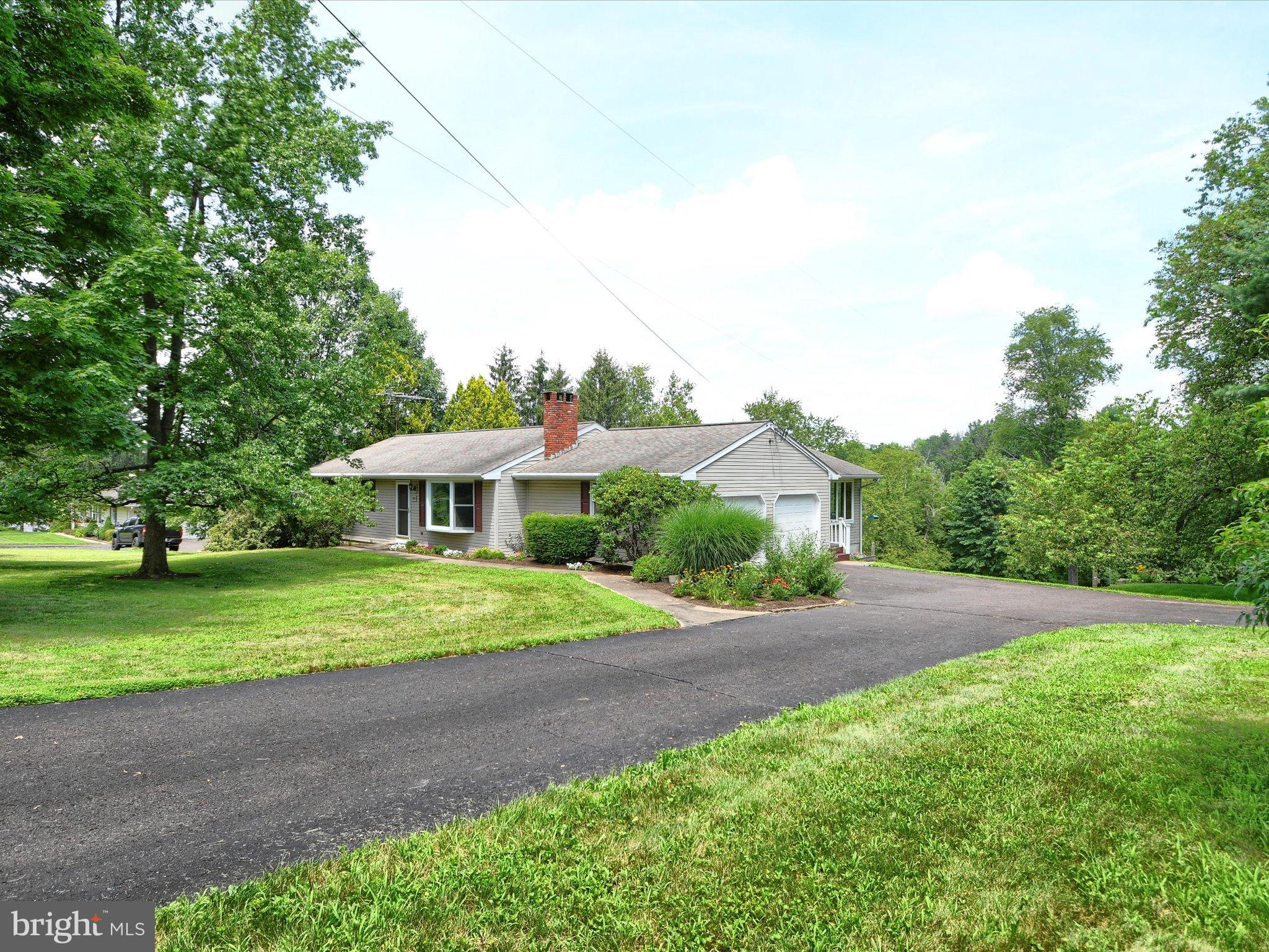 1209 Telegraph Road Perkasie, PA 18944 - Photo 39 of 49 a view of a garden with a house