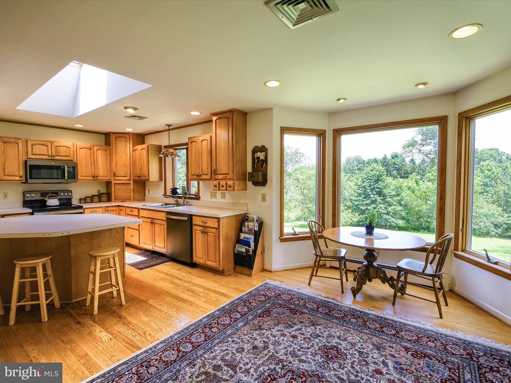 1209 Telegraph Road Perkasie, PA 18944 - Photo 4 of 49 a living room with stainless steel appliances kitchen island furniture and a large window