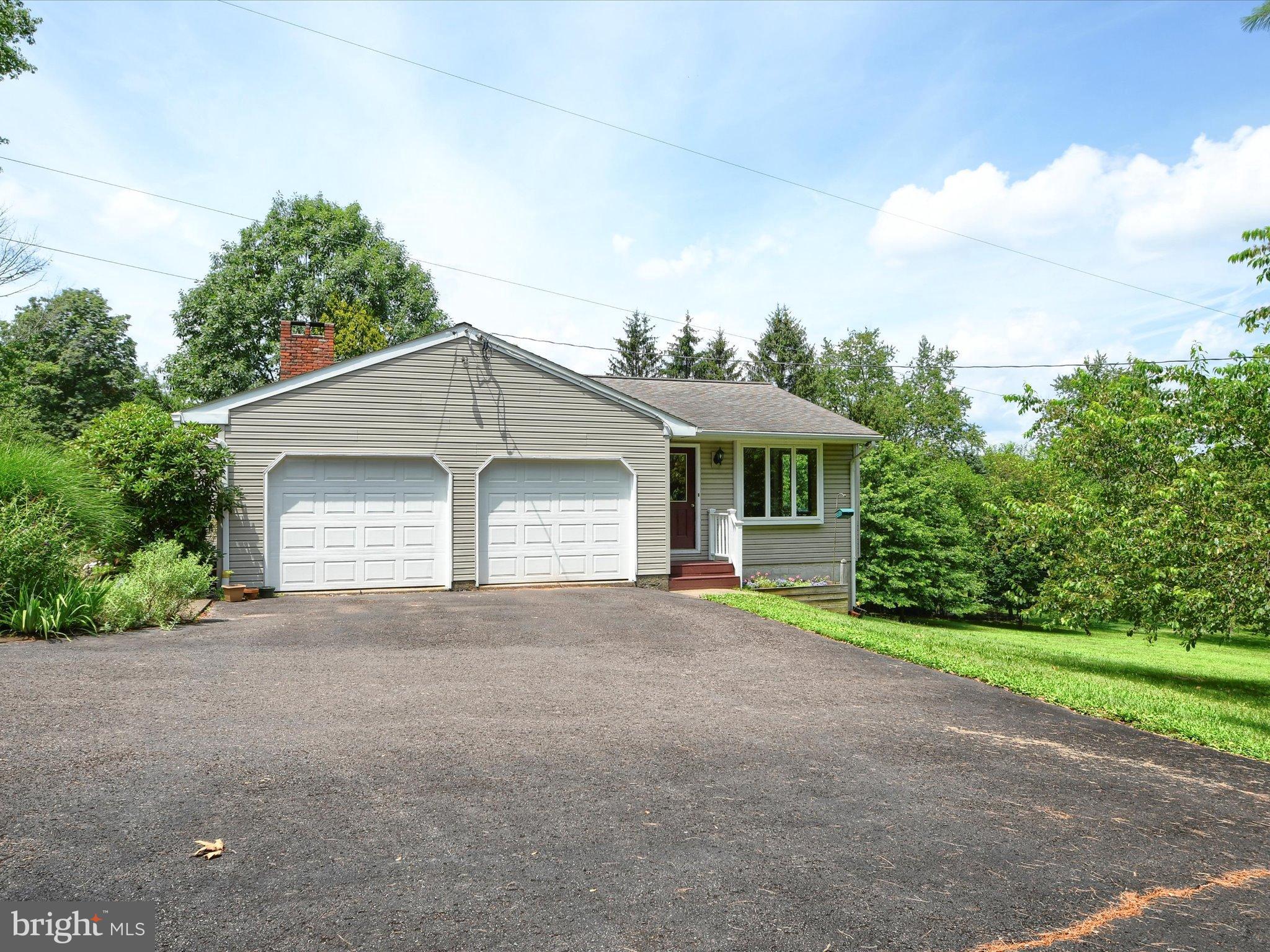 1209 Telegraph Road Perkasie, PA 18944 - Photo 41 of 49 a front view of a house with a yard and garage