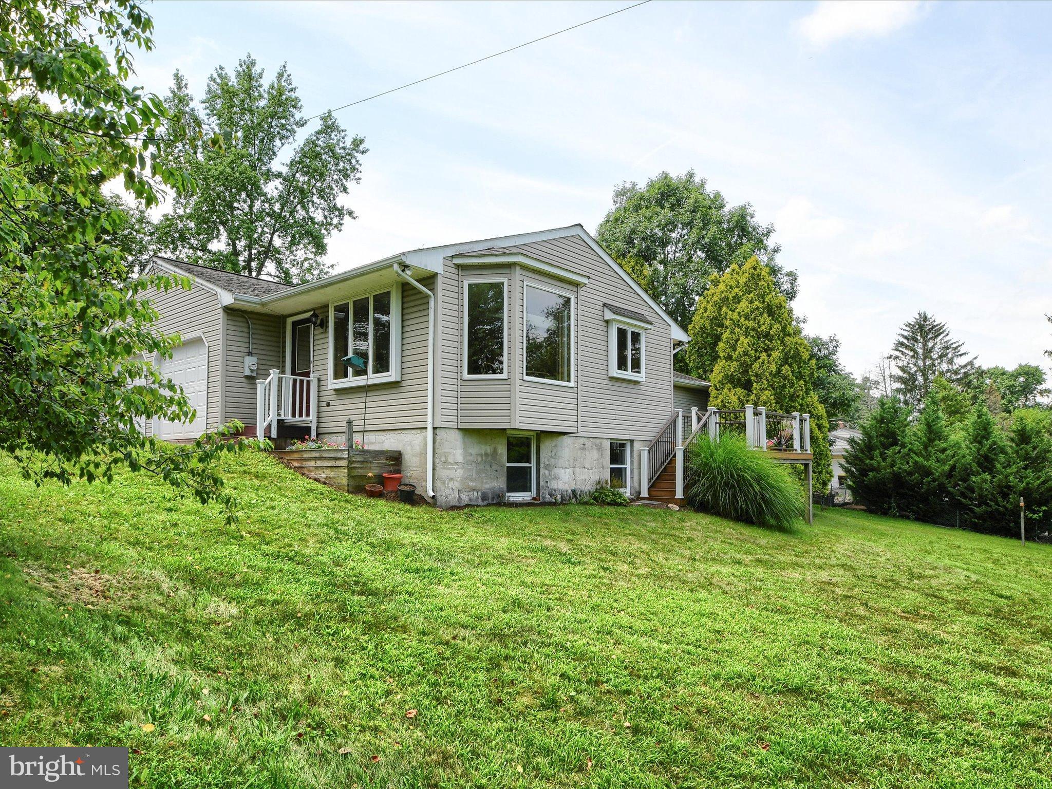 1209 Telegraph Road Perkasie, PA 18944 - Photo 42 of 49 a view of a house with a big yard and large trees
