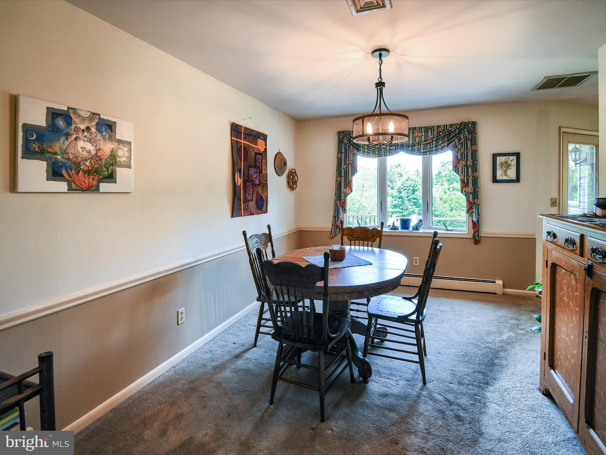 1209 Telegraph Road Perkasie, PA 18944 - Photo 7 of 49 a dining room with furniture a chandelier and window