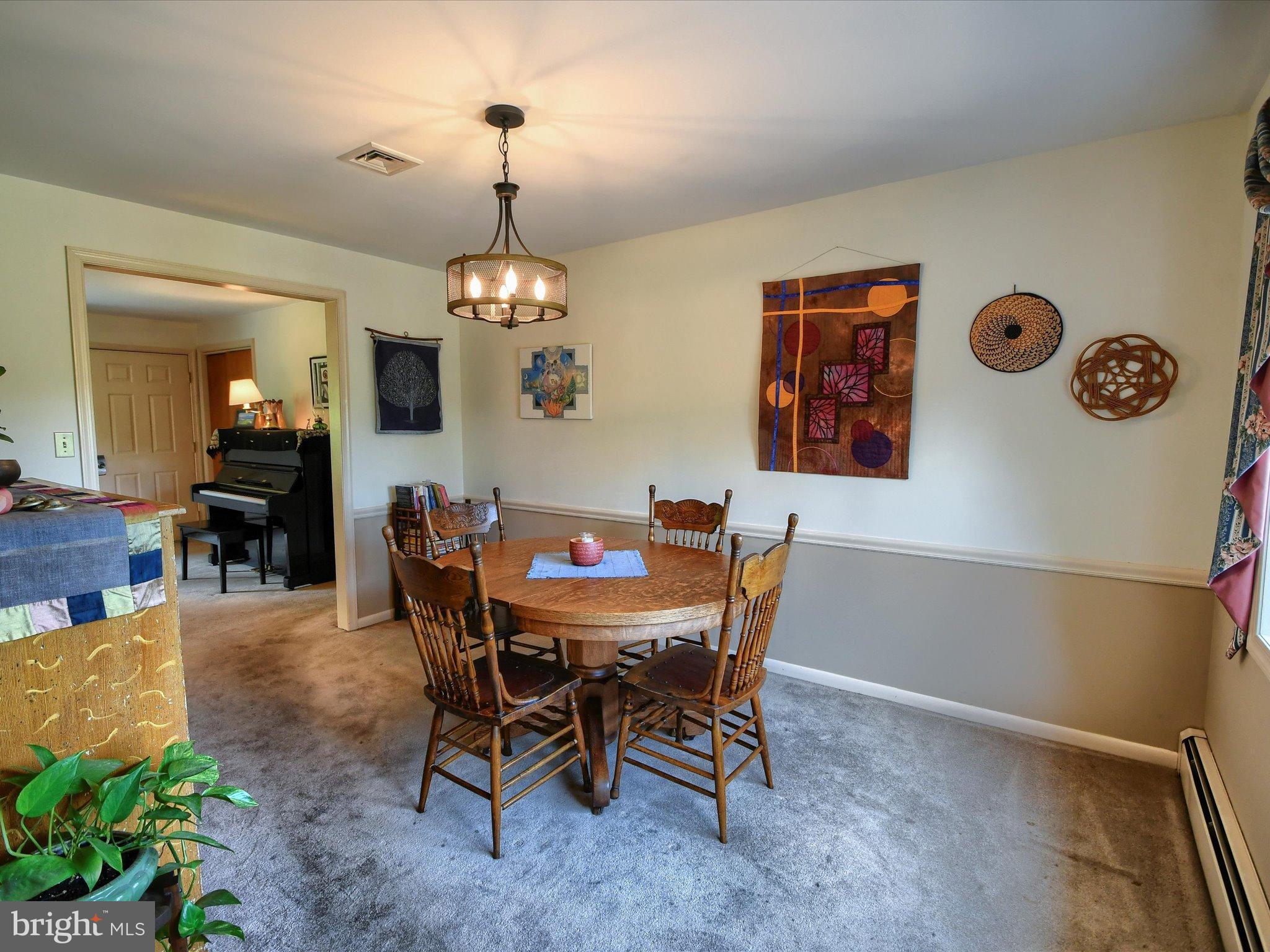 1209 Telegraph Road Perkasie, PA 18944 - Photo 8 of 49 a view of a dining room with furniture and chandelier