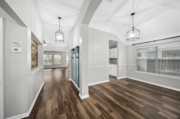 a view of a room with wooden floor and staircase