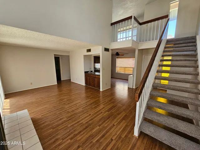 a view of an entryway with wooden floor