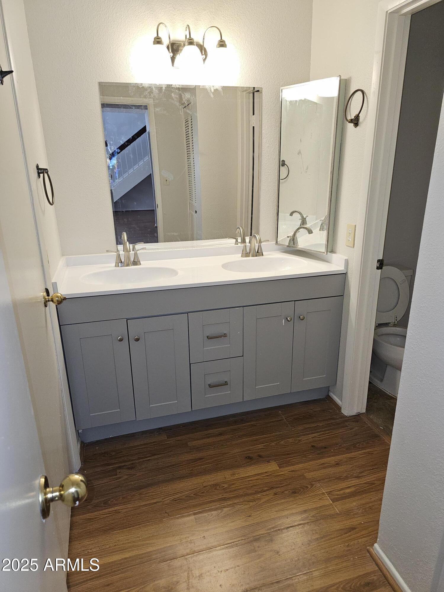 18227 North 45th Avenue Glendale, AZ 85308 - Photo 6 of 11 a bathroom with a sink and mirror