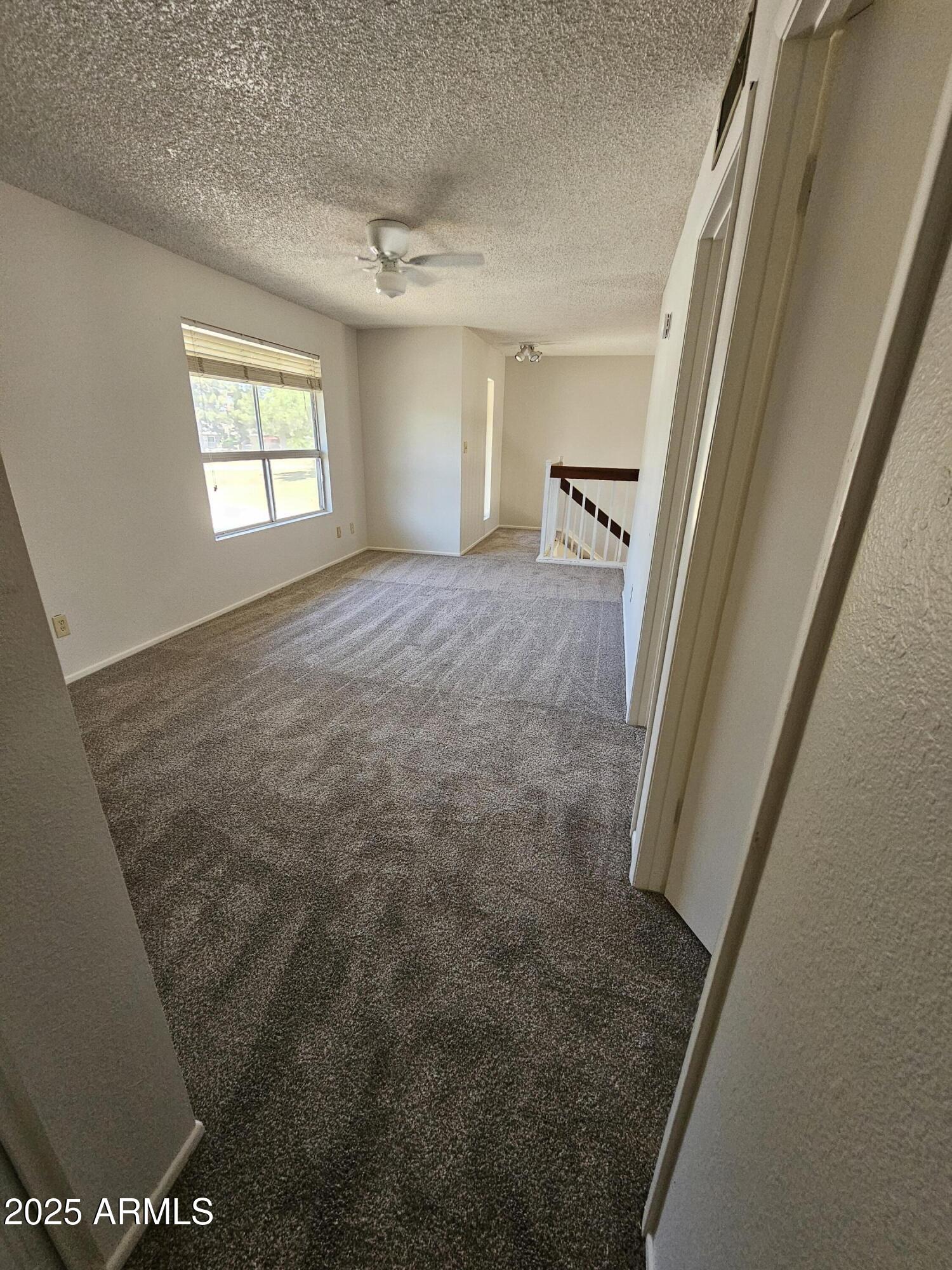 18227 North 45th Avenue Glendale, AZ 85308 - Photo 7 of 11 a view of an empty room and a windows