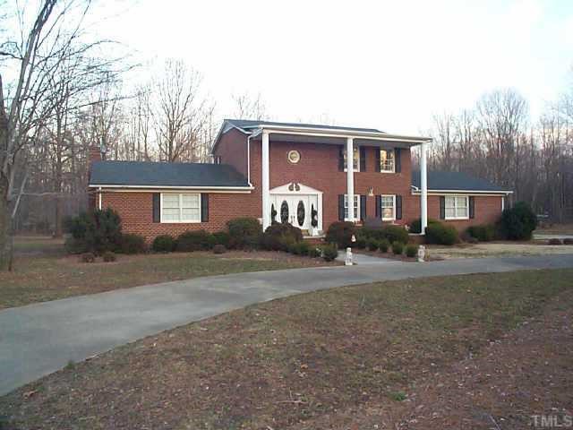 8460 Boston Road Roxboro, NC 27574 - Photo 1 of 1 a front view of a house with a yard