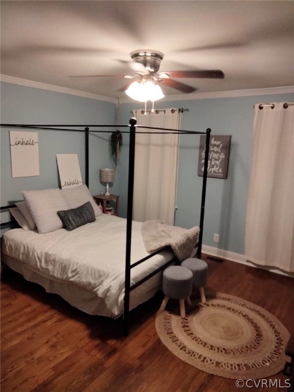 9855 Mosswood Road North Chesterfield, VA 23236 - Photo 14 of 15 a bedroom with a bed and wooden floor