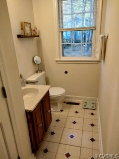 9855 Mosswood Road North Chesterfield, VA 23236 - Photo 15 of 15 a bathroom with a sink toilet and window