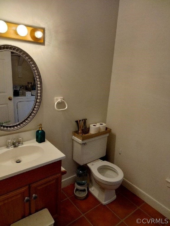9855 Mosswood Road North Chesterfield, VA 23236 - Photo 2 of 15 a bathroom with a toilet a sink and mirror