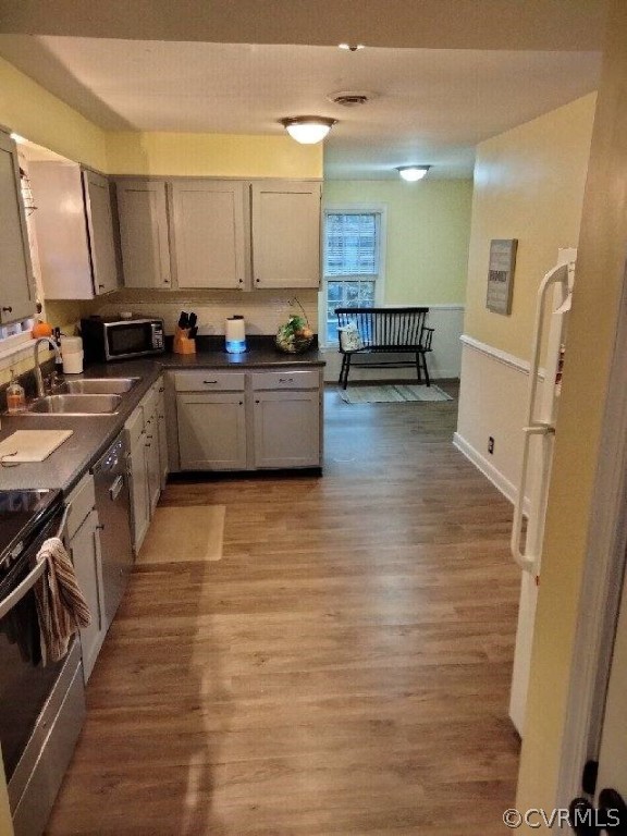 9855 Mosswood Road North Chesterfield, VA 23236 - Photo 5 of 15 a large kitchen with stainless steel appliances granite countertop a stove and a refrigerator