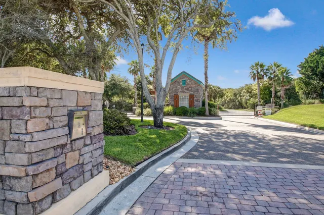 a view of a garden with a building in the background