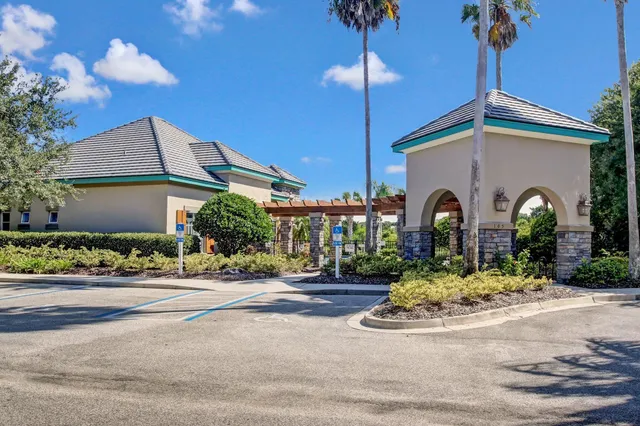 a view of swimming pool with outdoor seating and plants
