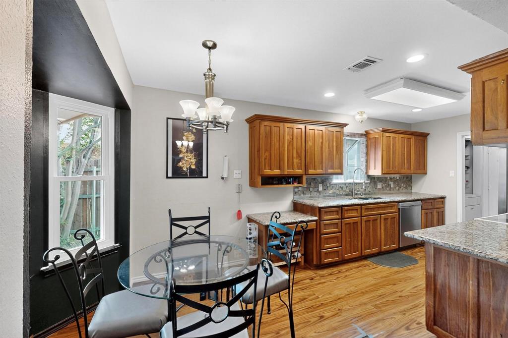 6617 Whitley Road Watauga, TX 76148 - Photo 14 of 36 a kitchen with stainless steel appliances granite countertop a stove and a refrigerator