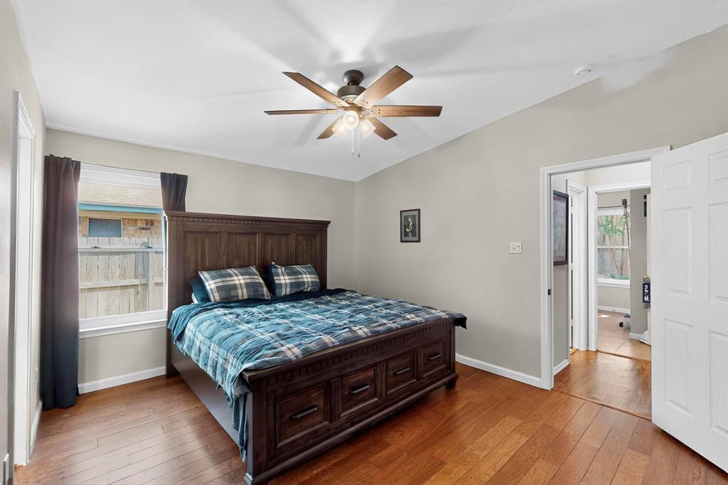 6617 Whitley Road Watauga, TX 76148 - Photo 18 of 36 a bedroom with a bed and wooden floor