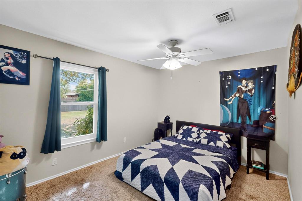 6617 Whitley Road Watauga, TX 76148 - Photo 23 of 36 a bedroom with a bed and a window