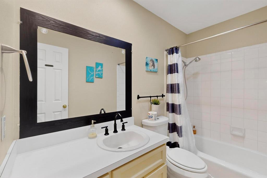 6617 Whitley Road Watauga, TX 76148 - Photo 25 of 36 a bathroom with a sink toilet and shower