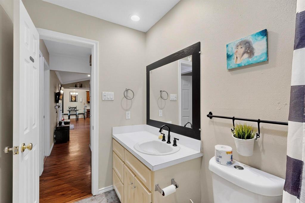 6617 Whitley Road Watauga, TX 76148 - Photo 26 of 36 a bathroom with a sink and a mirror