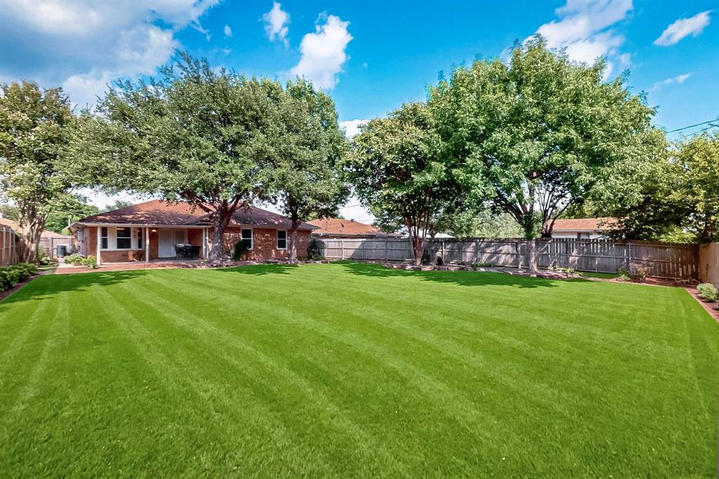 6617 Whitley Road Watauga, TX 76148 - Photo 31 of 36 a view of a house with a yard