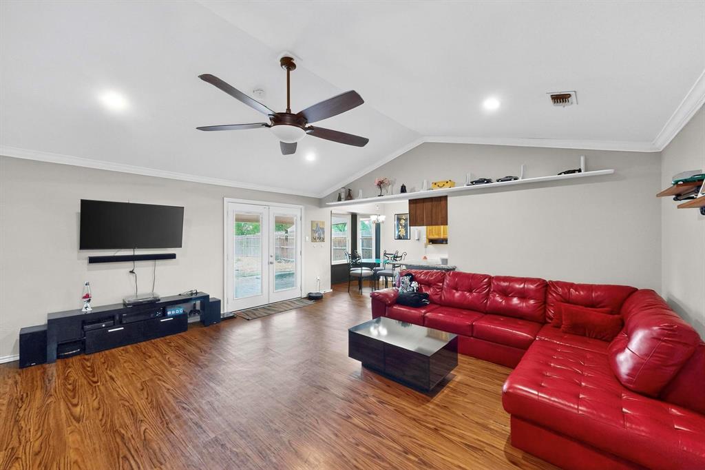 6617 Whitley Road Watauga, TX 76148 - Photo 9 of 36 a living room with furniture and a flat screen tv