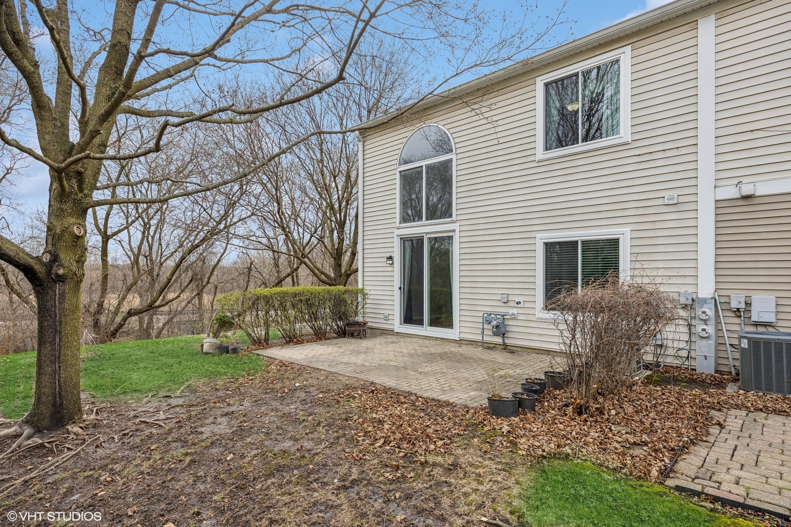 1601 Spaulding Road Bartlett, IL 60103 - Photo 15 of 15 a front view of a house with garden and trees