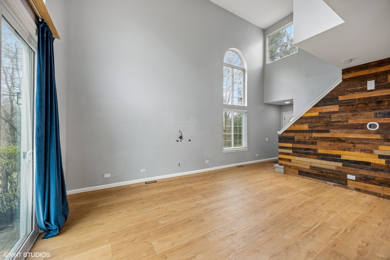 1601 Spaulding Road Bartlett, IL 60103 - Photo 3 of 15 a view of an empty room with stairs and a window